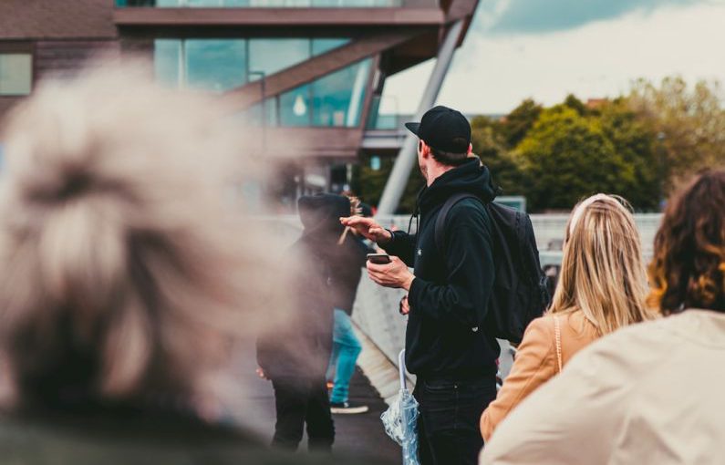 Startup Guide - people standing near building