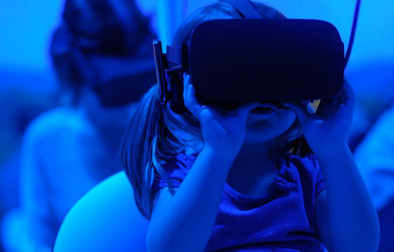 Future Trends - girl using VR goggles
