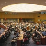 SDGs Goals - people sitting on chairs inside building