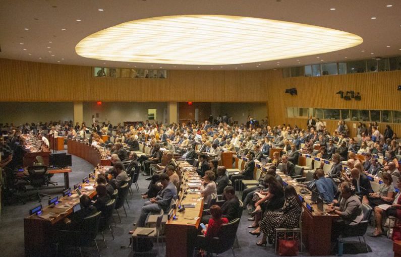 SDGs Goals - people sitting on chairs inside building