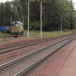 Crowdfunding Platform - a train traveling down train tracks next to a forest