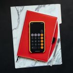 Funding Resources - black Android smartphone on red flip case