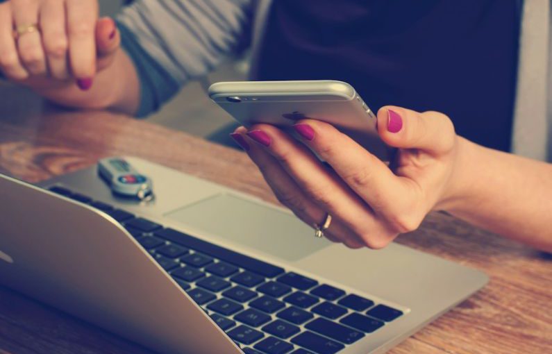 Technology Impact - woman holding silver iPhone 6