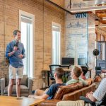 Startup Eco - man standing in front of group of men