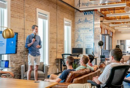 Startup Eco - man standing in front of group of men