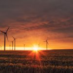 Renewable Startup - windmill on grass field during golden hour